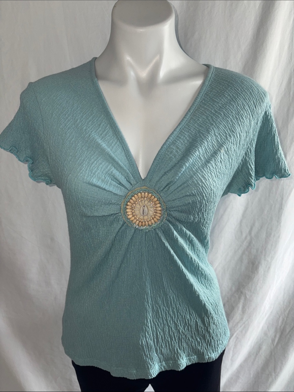 Susan Lawrence Teal Short Sleeve Top with Decorative Shell Medallion